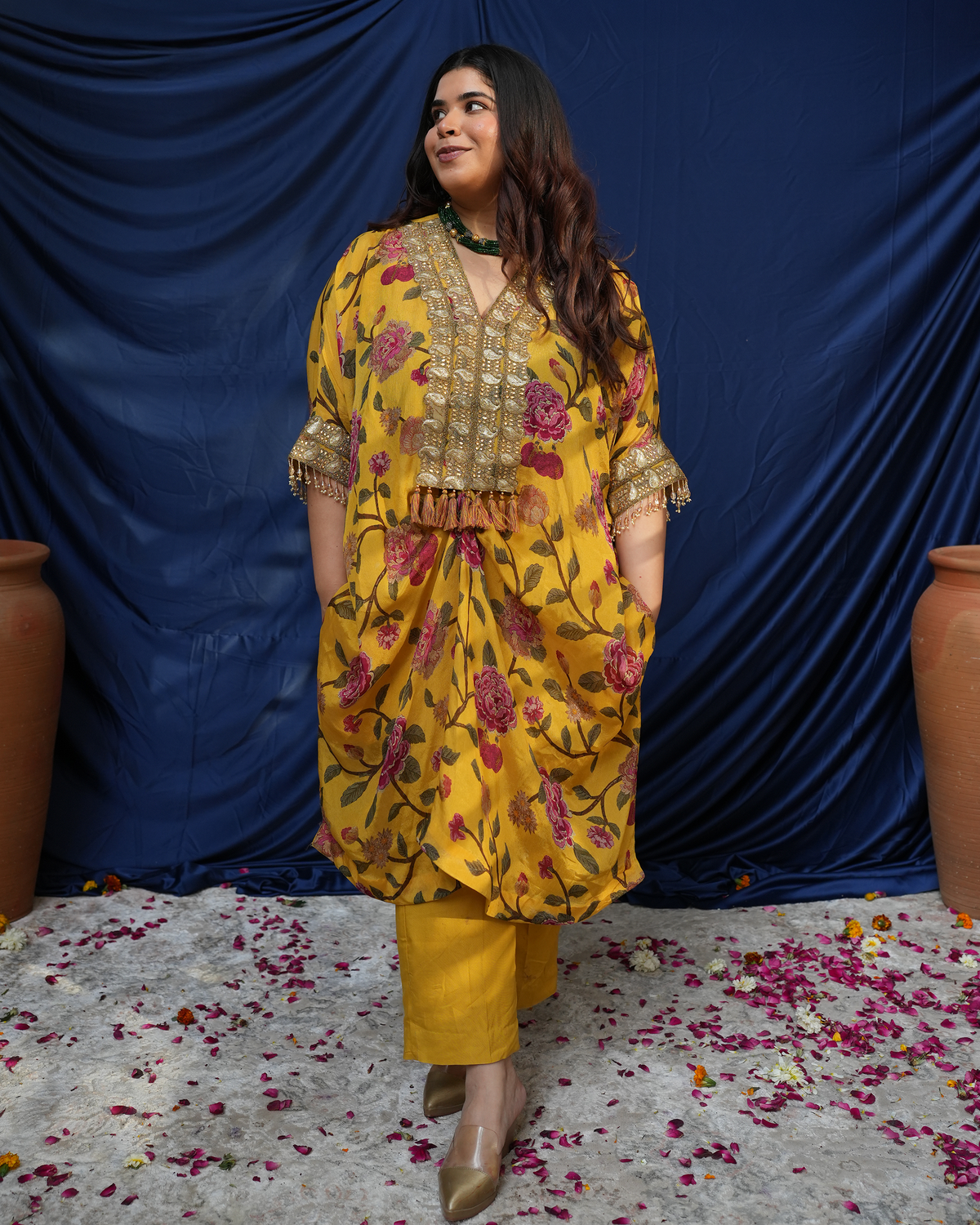 Nargis by House of Somarra — Three-quarter view of the floral kaftan and straight trousers.