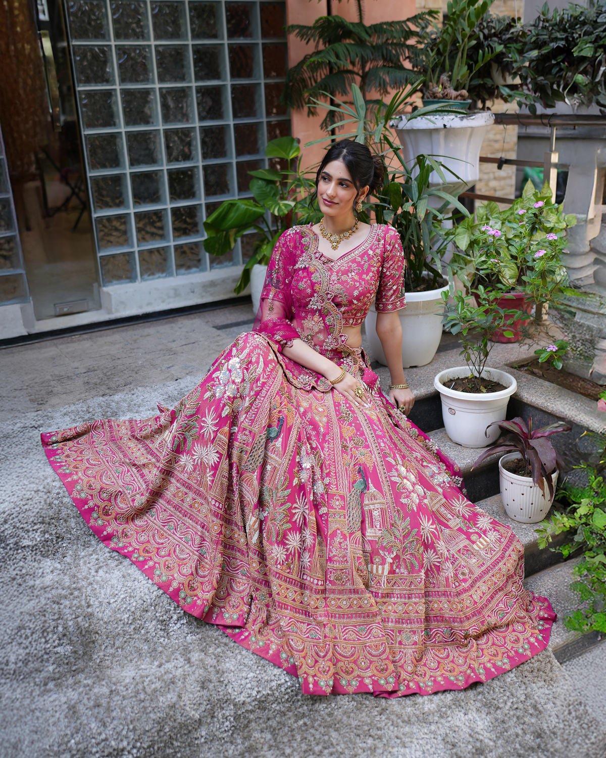 Aakriti by House of Somarra — Seated view showing the illustrated motifs across the flared skirt.