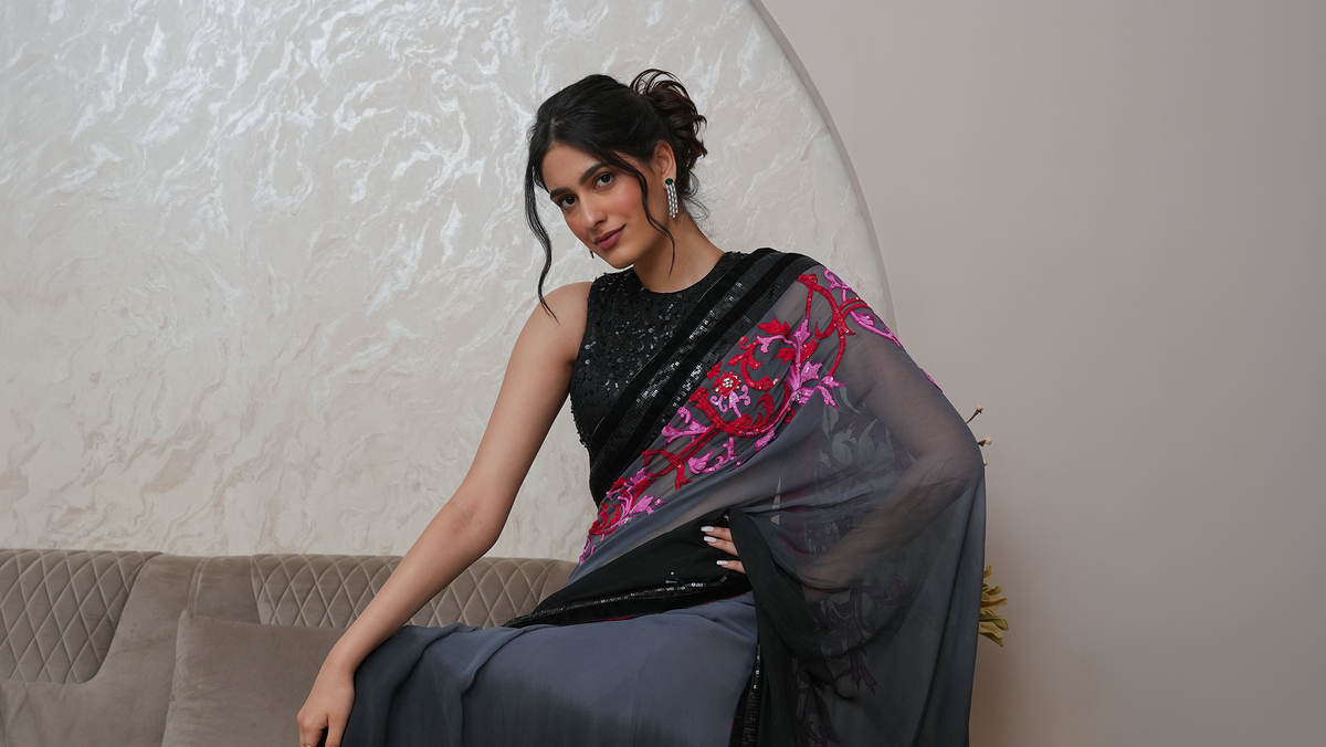 Luna by House of Somarra — Seated view of the grey drape and pink floral border.