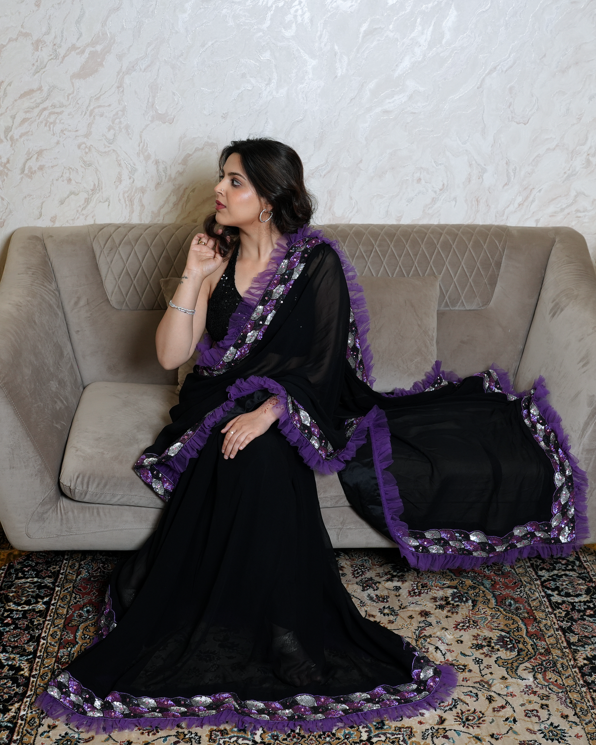 Zaria by House of Somarra — Portrait view showing the purple ruffled pallu around the shoulders.