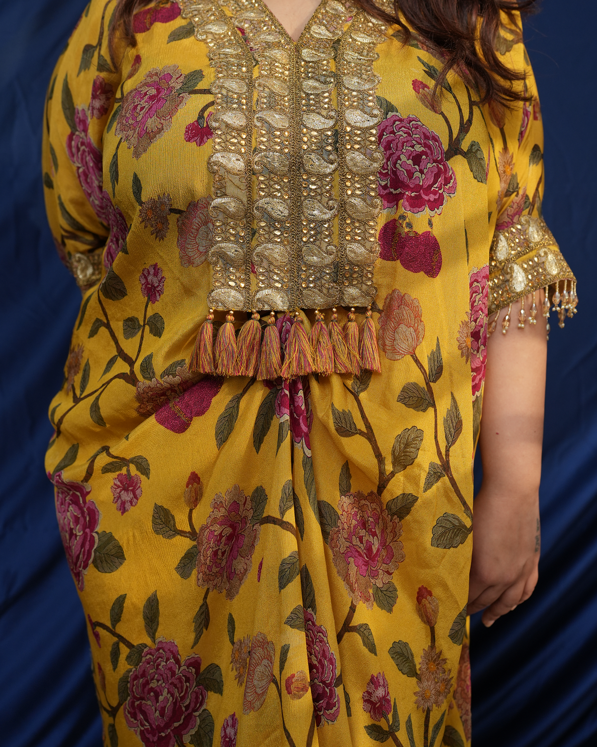 Nargis by House of Somarra — Close-up of the ornate neckline panel, tassels and floral print.