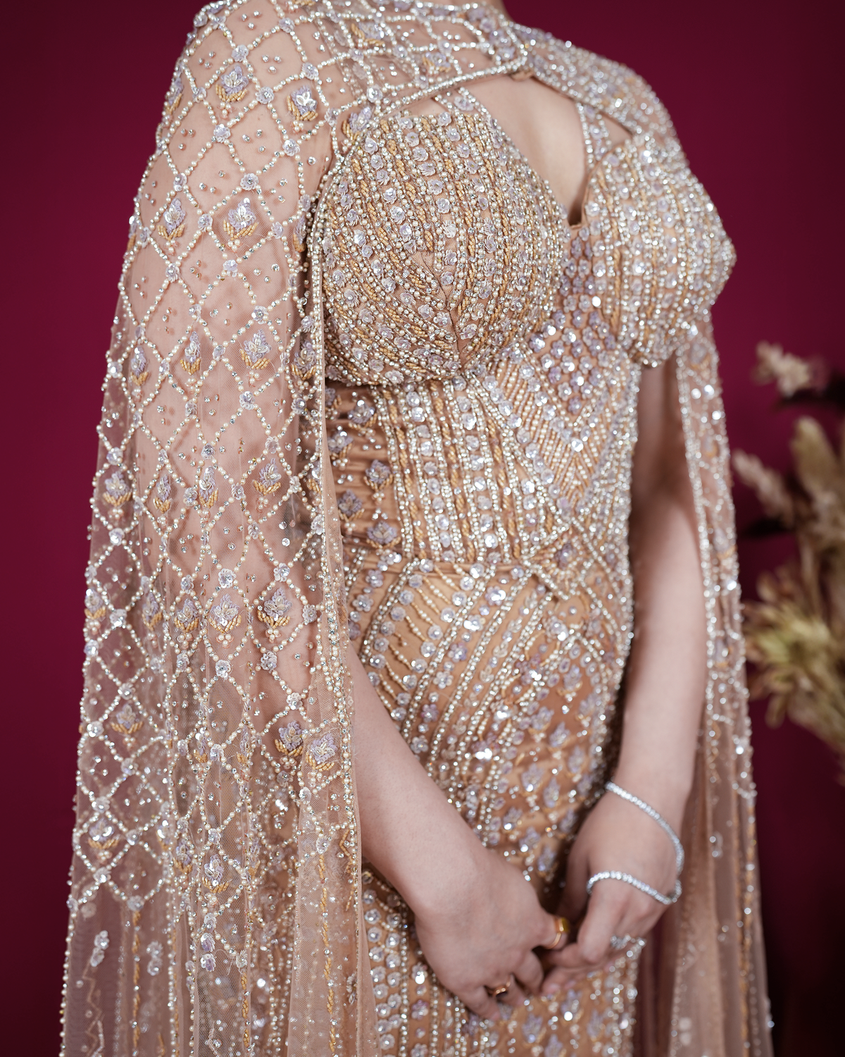 Aurelia by House of Somarra — Close-up of the fitted bodice, waist and cape embroidery.