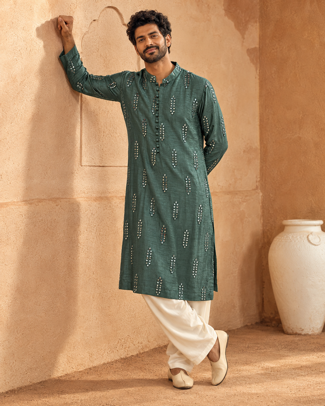 Aks by House of Somarra — Full-length view of the bottle-green mirrorwork kurta with ivory trousers.