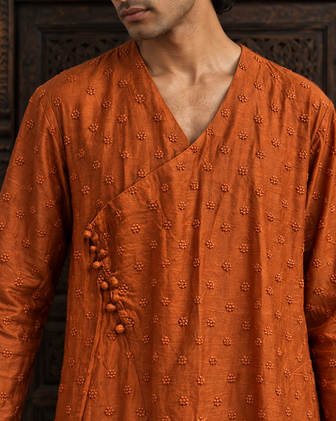 Aatish: Burnt Orange Angrakha Men's Kurta Set — close-up of the garment details.
