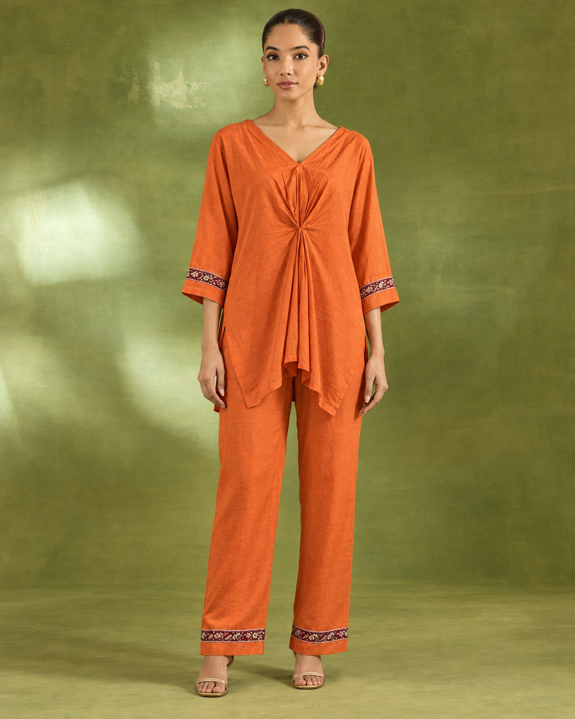 Arunika by House of Somarra — Full-length view showing the gathered front and decorated cuffs.