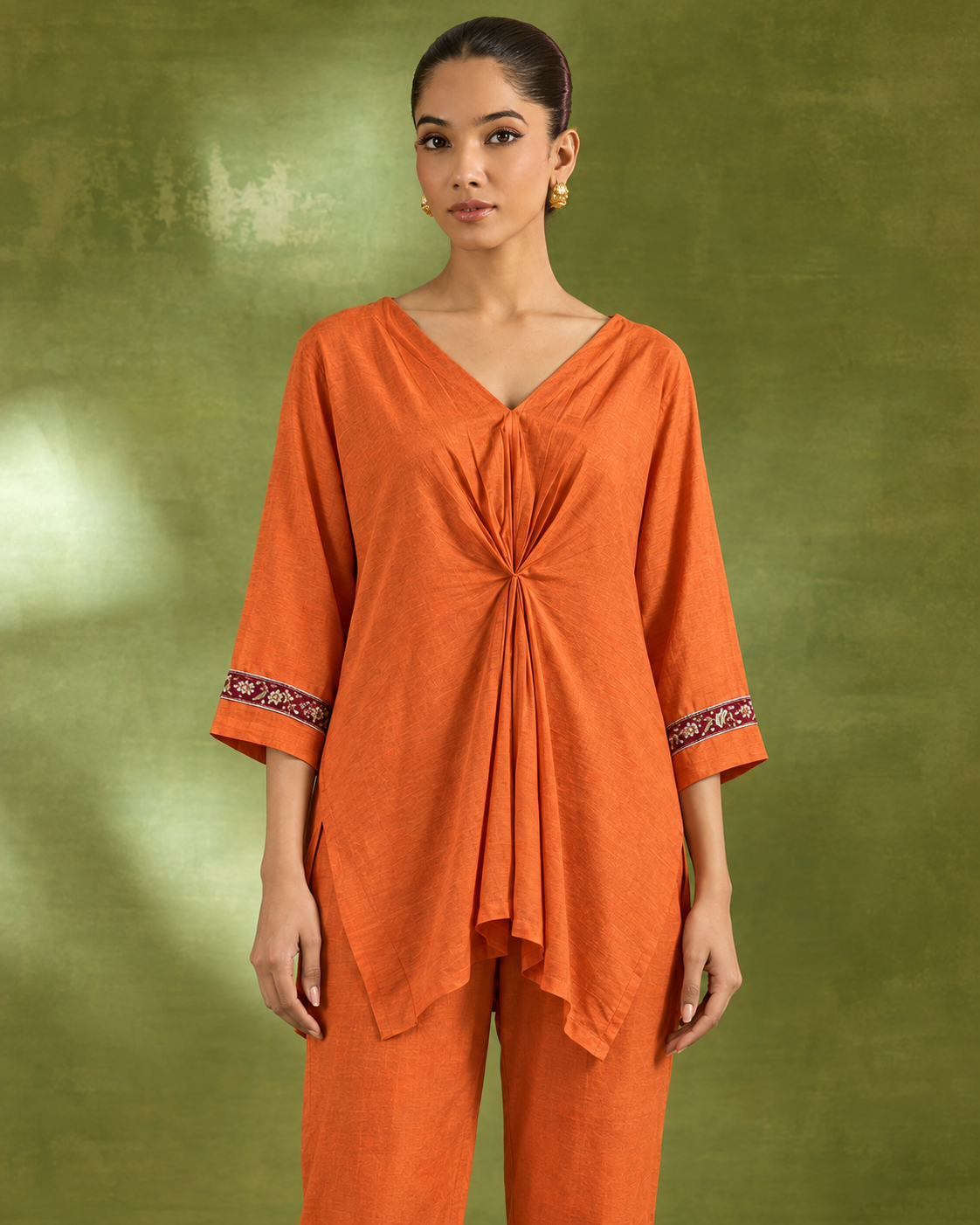 Arunika by House of Somarra — Close-up of the gathered orange neckline and sleeve borders.