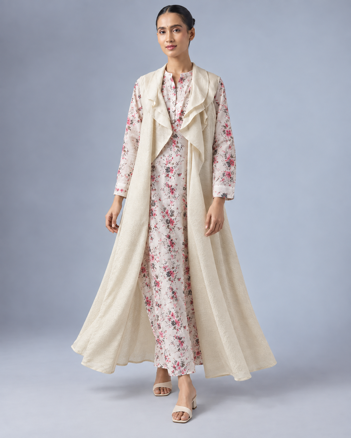 Varnika by House of Somarra — Full-length view of the floral kurta and long pale gold-toned shrug.