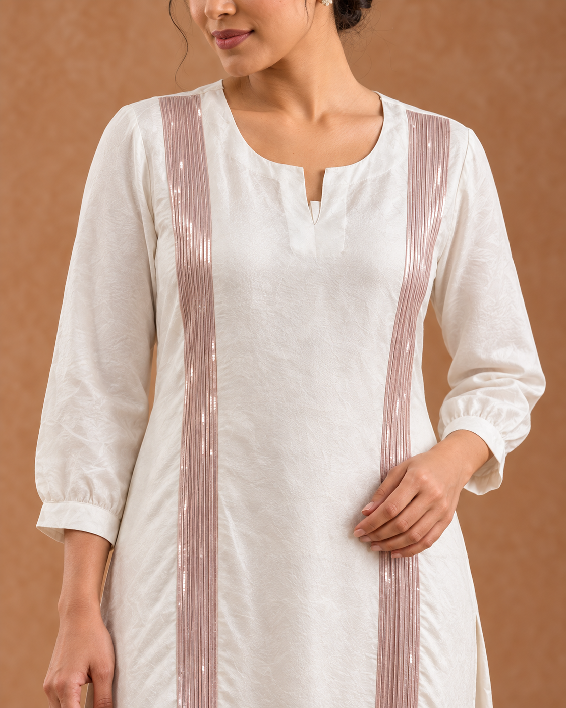 Aurelle by House of Somarra — Close-up of the neckline and rose-gold front details.