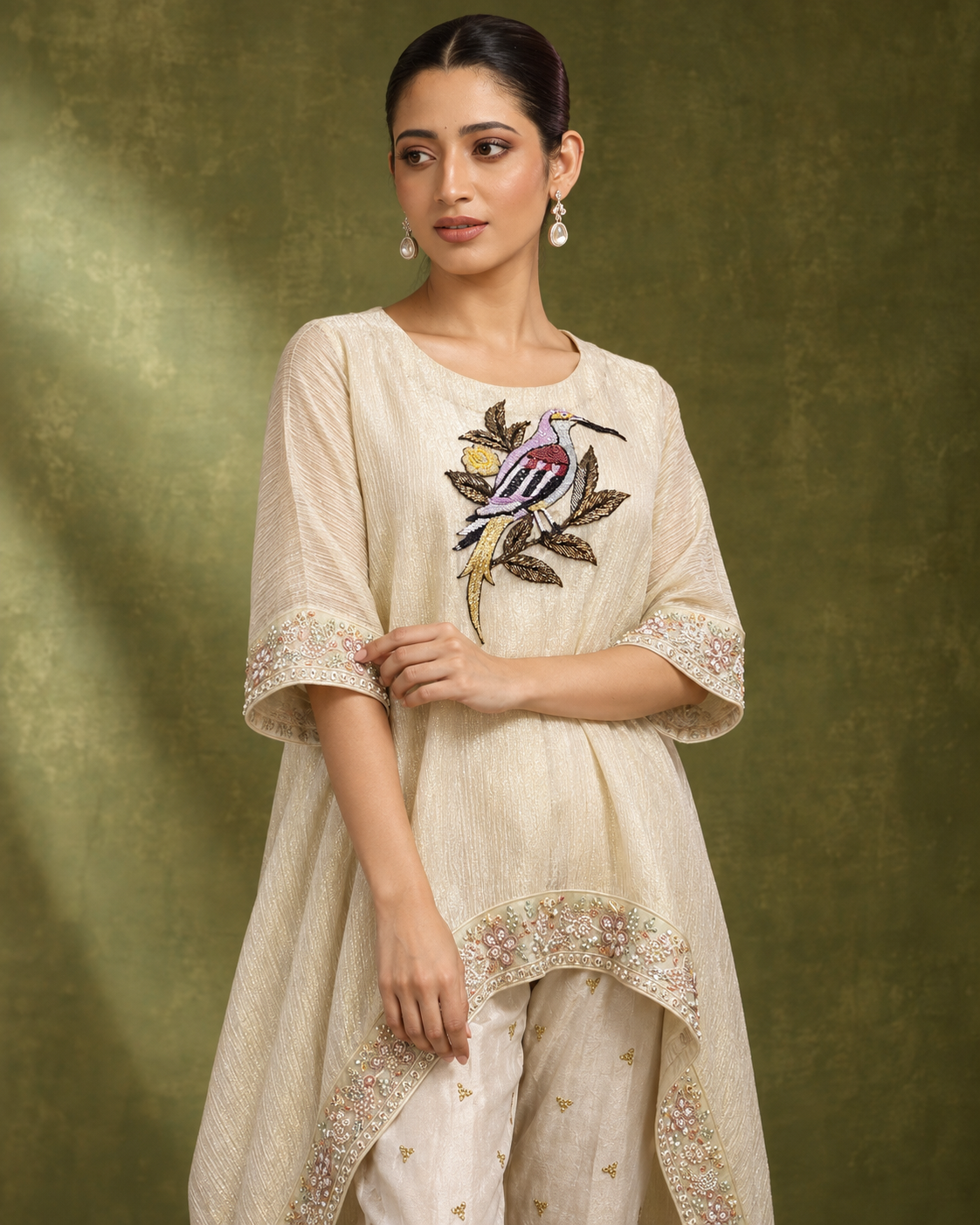 Parvaaz by House of Somarra — Mid-length view of the bird motif and embellished sleeve edges.