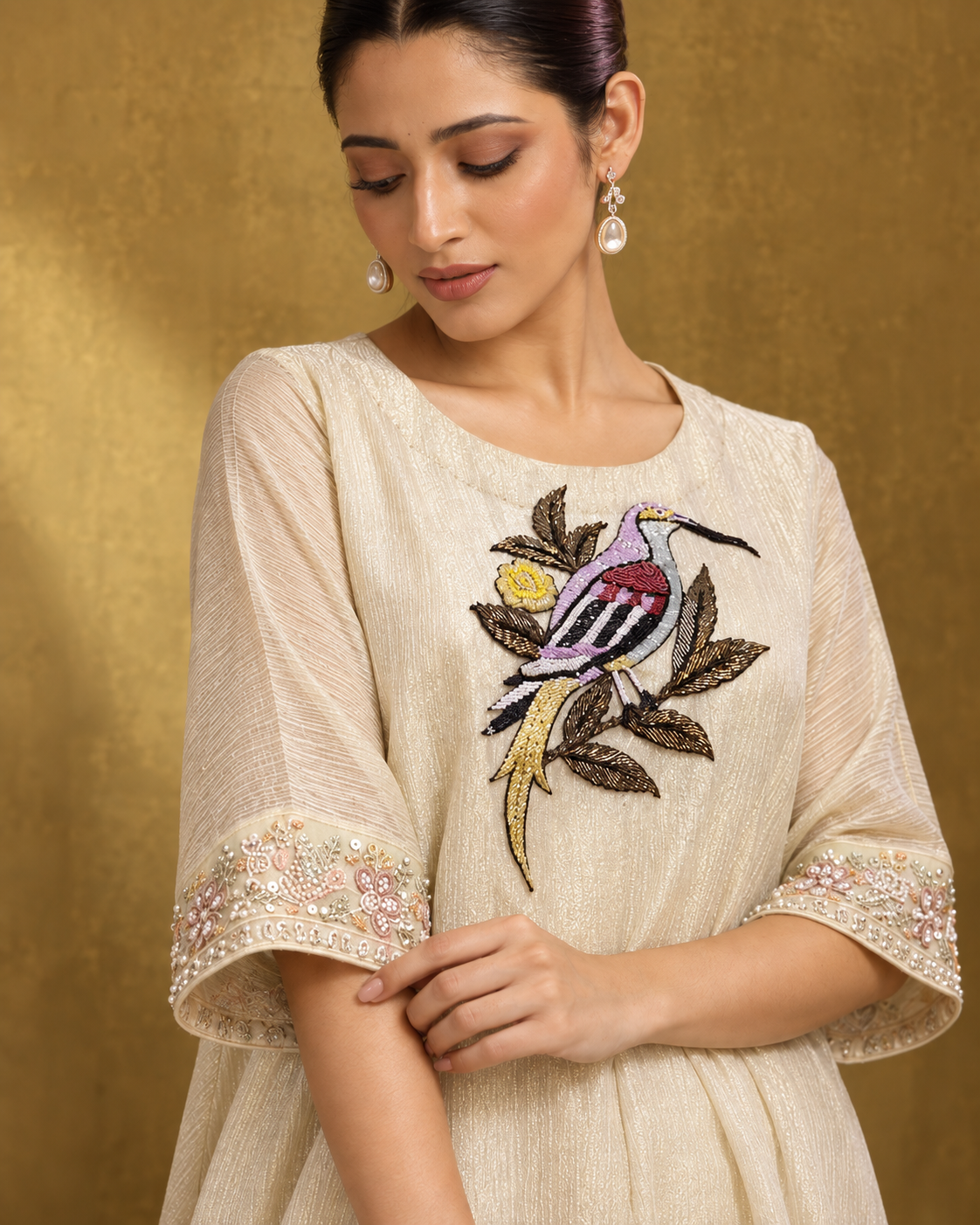 Parvaaz by House of Somarra — Close-up of the bird embroidery, round neckline and sleeve border.