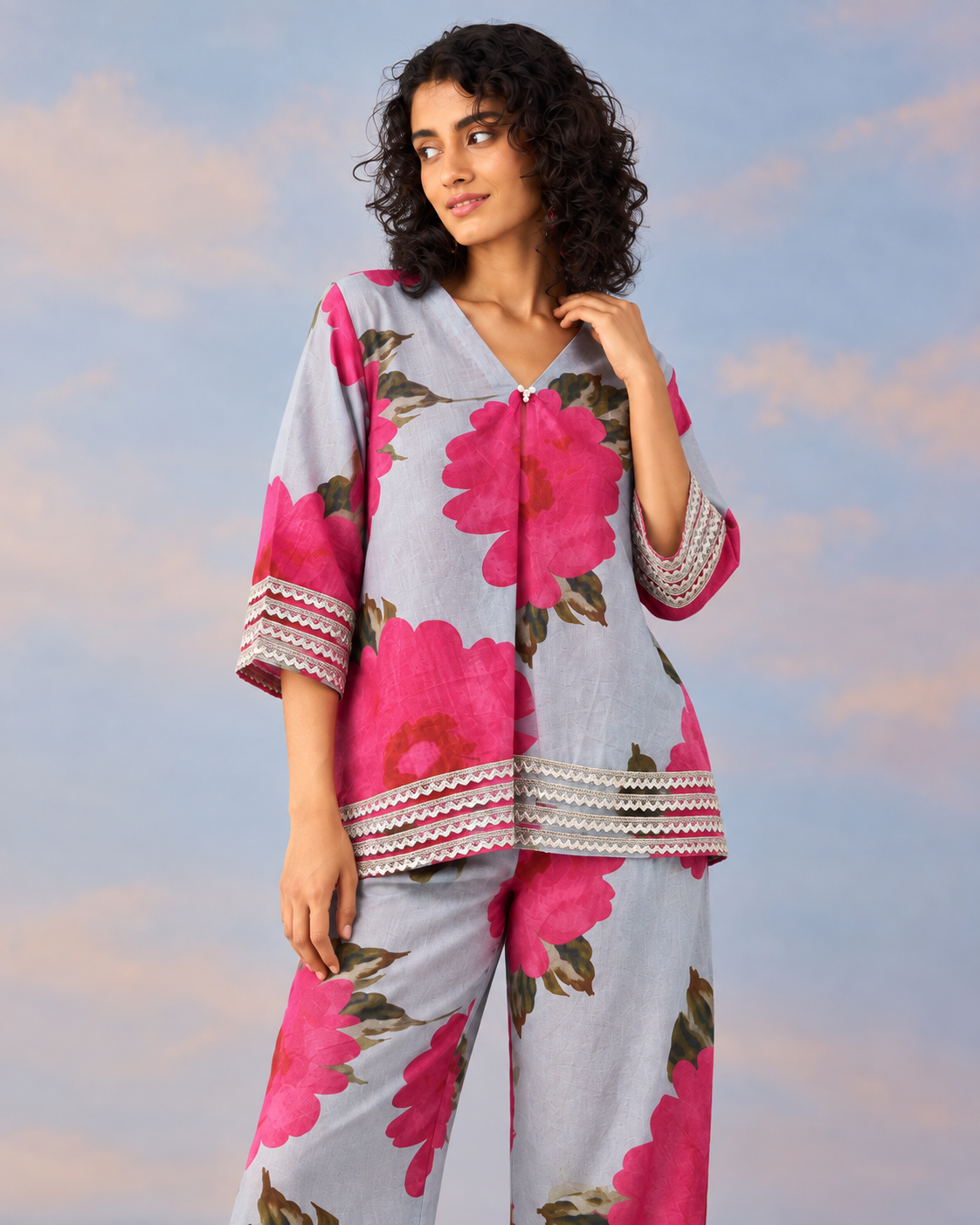 Gulaira by House of Somarra — Portrait view of the floral shirt, collar and sleeve trim.