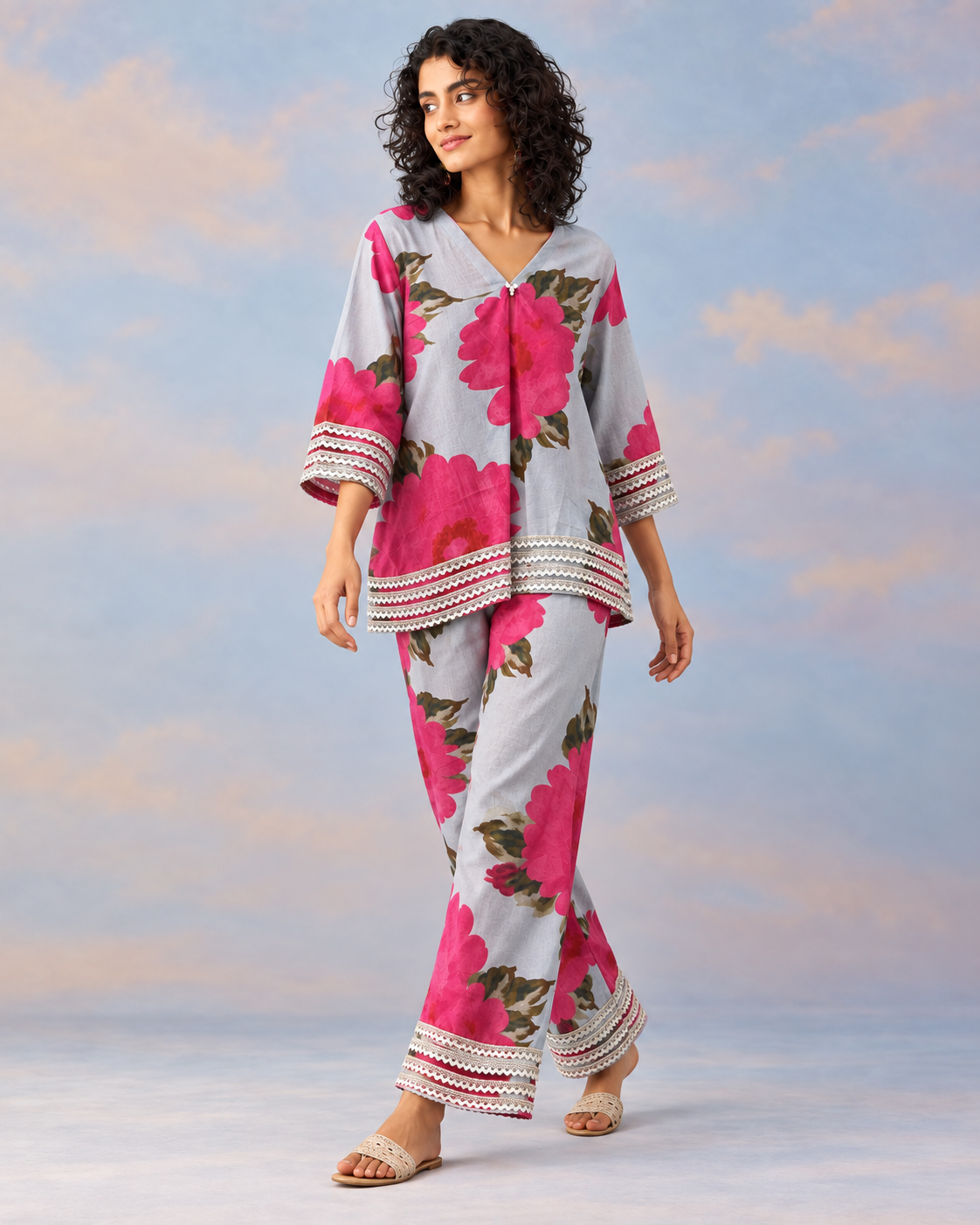 Gulaira by House of Somarra — Walking view of the loose floral shirt and trousers.