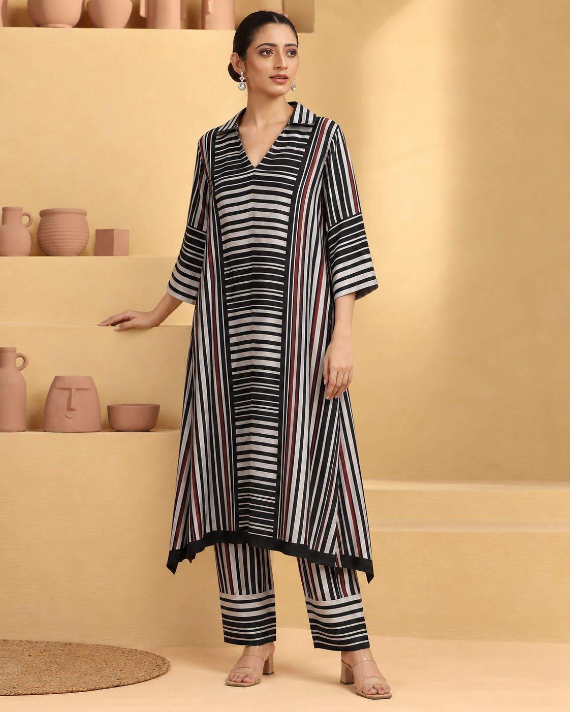 Tirya by House of Somarra — Full-length view showing the pointed hem and loose trousers.