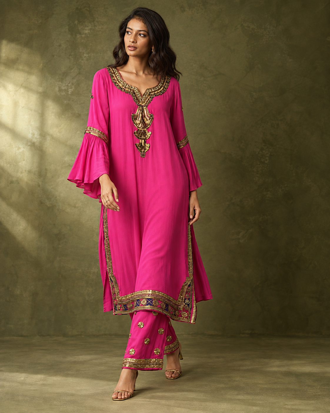 Amoli by House of Somarra — Walking view showing the flared sleeves and decorative hems.