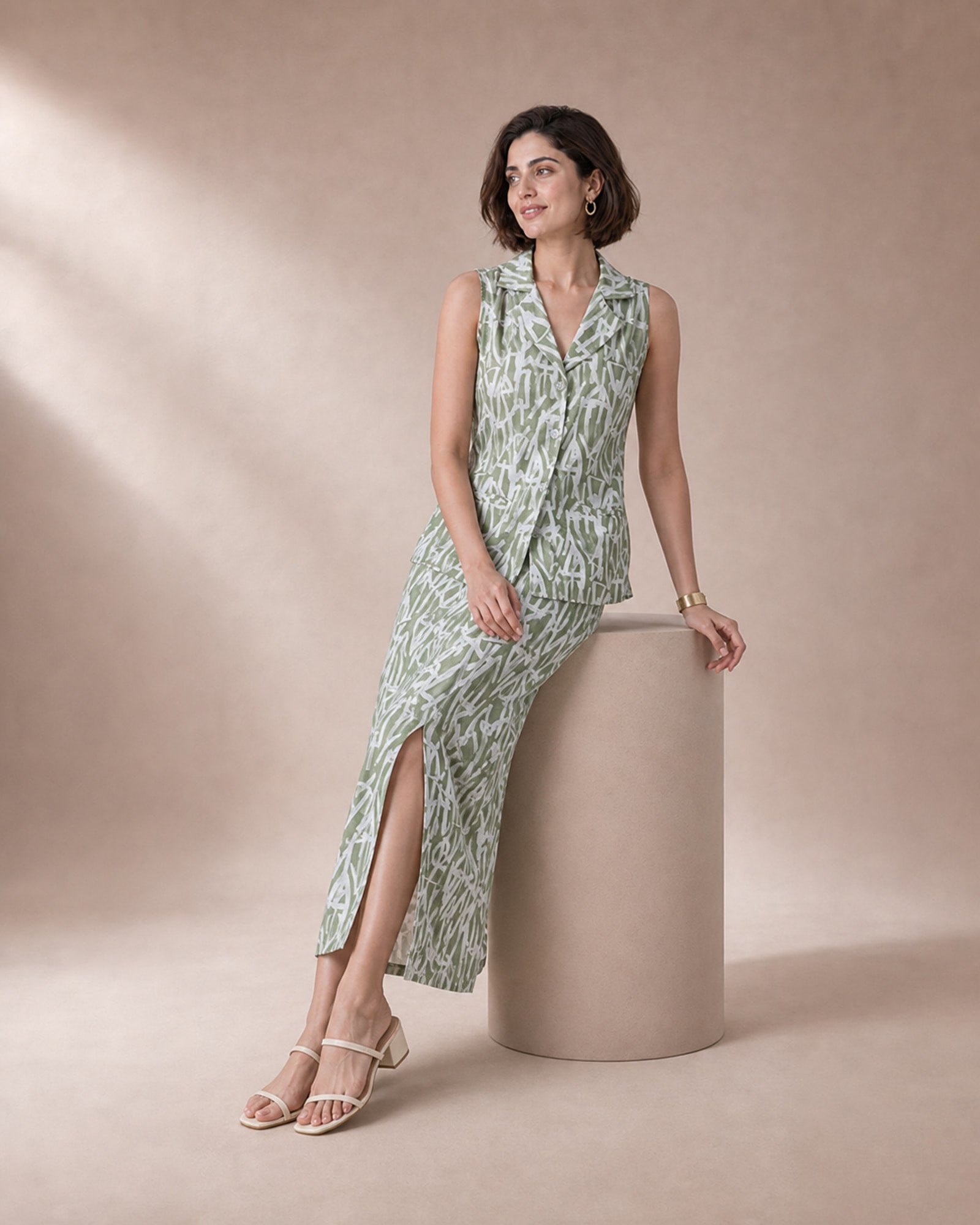 Olivara olive abstract cotton-georgette top and skirt set – edge-perch view showing the skirt slit