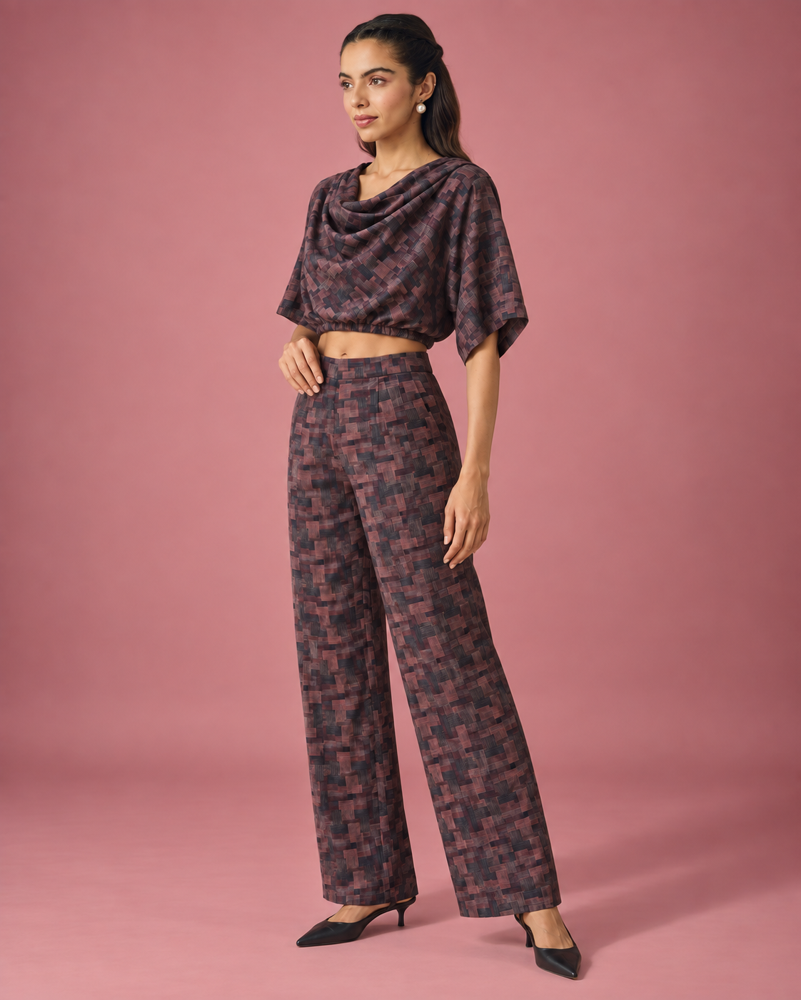 Avira by House of Somarra — Side view of the dark patterned cowl top and matching trousers.