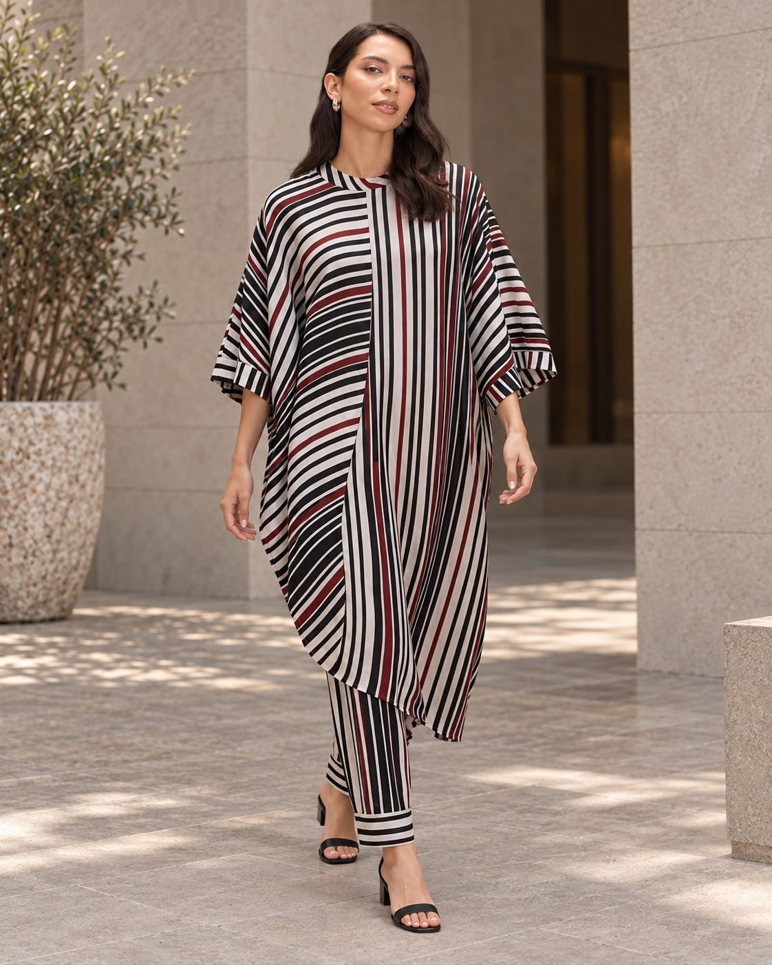 Vayra by House of Somarra — Full-length view showing the draped striped tunic.