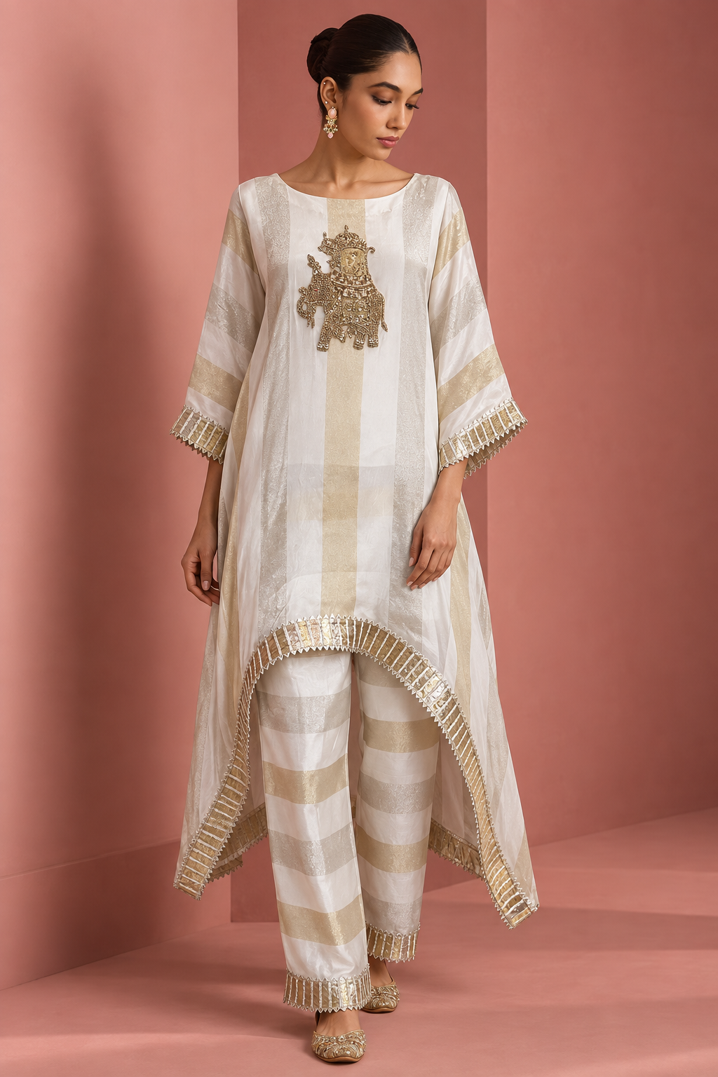 Kashvi by House of Somarra — Front view showing the loose ivory kaftan and trouser silhouette.