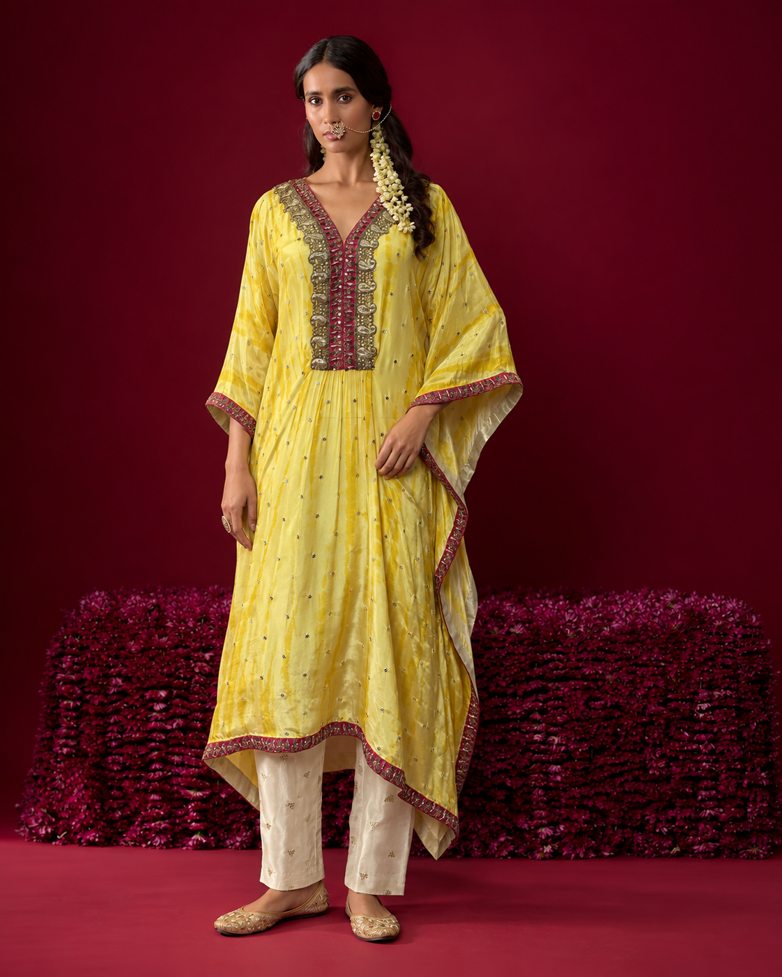 Amara by House of Somarra — Full-length view of the yellow kaftan and ivory trousers.