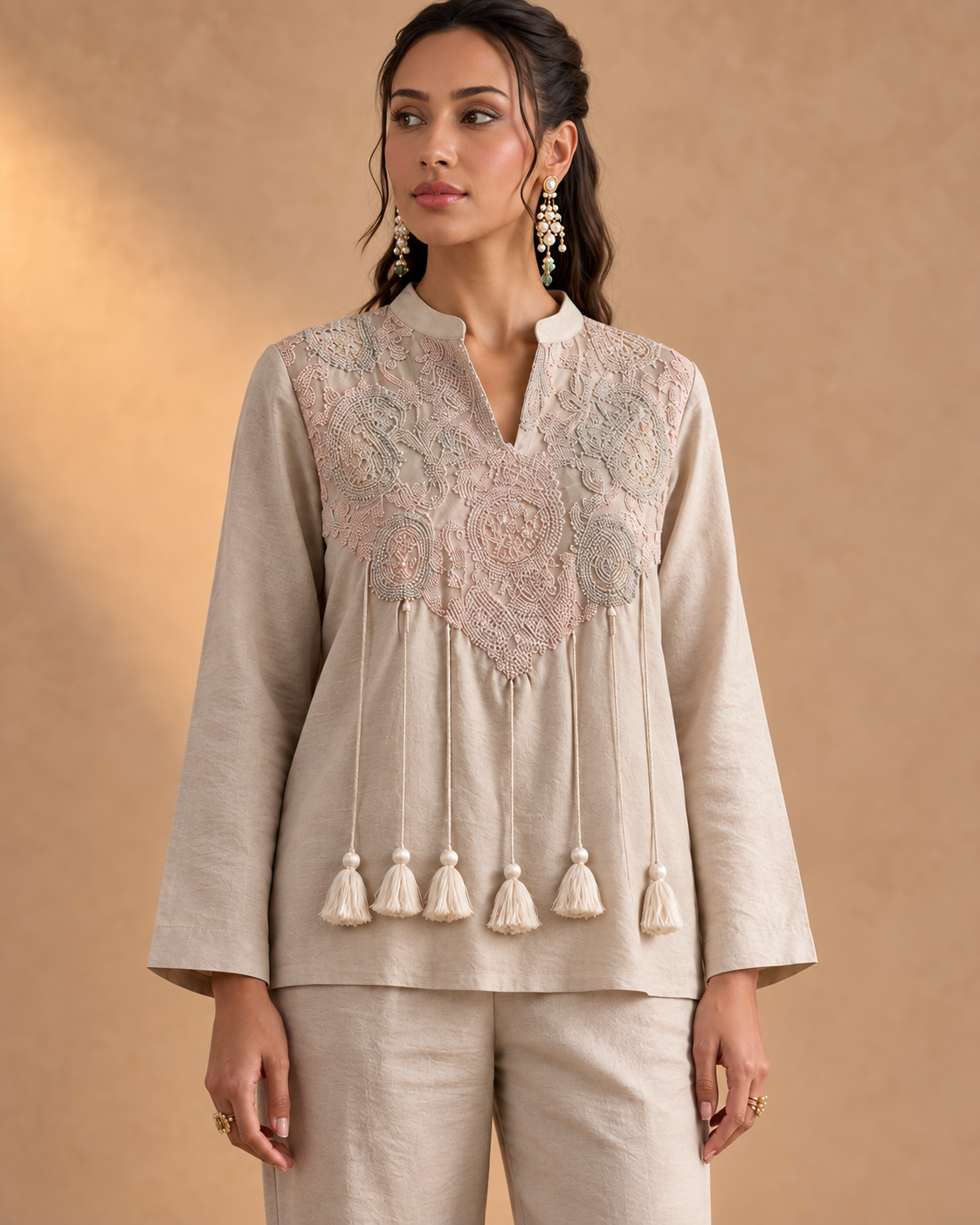 Noorika by House of Somarra — Close-up of the embroidered neckline and hanging waist tassels.