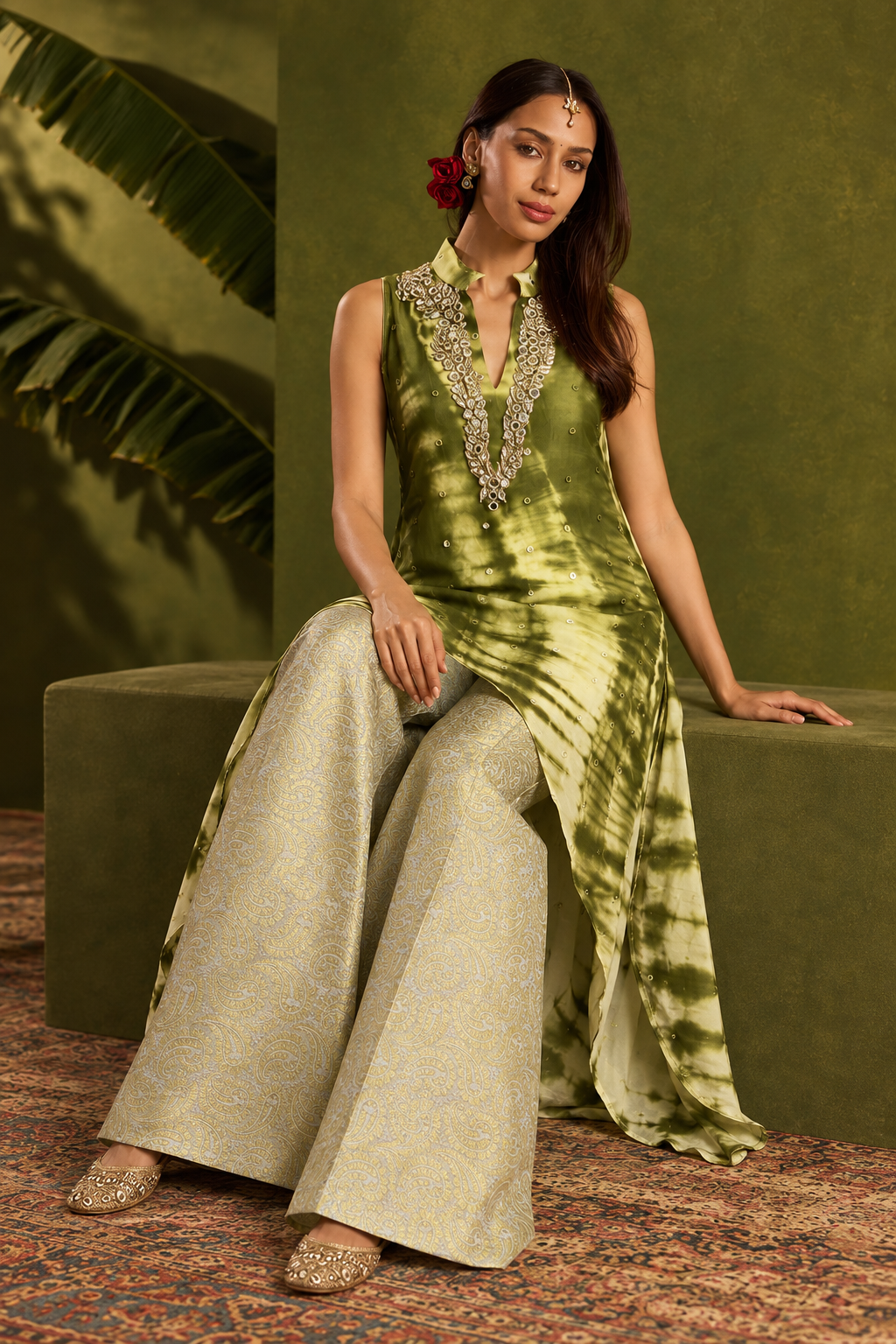 Aiza by House of Somarra — Seated view showing the tie-dye tunic and flared trousers.