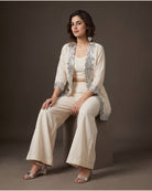 Aaina: Ivory Mirrorwork Three-Piece Co-ord Set – seated three-quarter