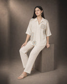 Mihira: Cream Crochet Crush Co-ord Set – seated three-quarter