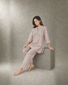 Noorika: Blush Zari-Tassel Co-ord Set – seated three-quarter