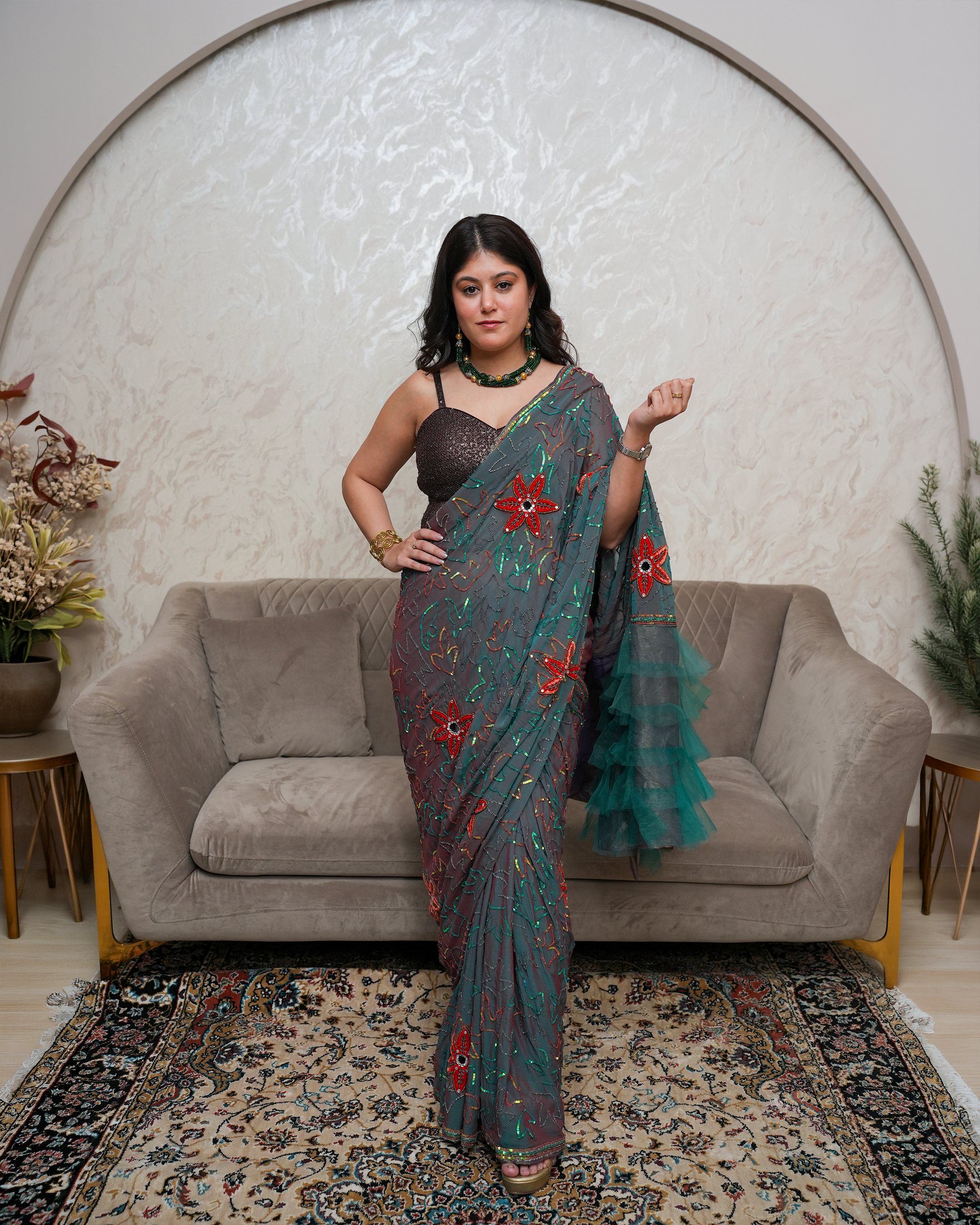 Ziana by House of Somarra — Full-length front view of the grey-green saree with red floral embroidery.