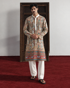 Dastaan by House of Somarra — Front view of the illustrated heritage-print kurta and ivory trousers.