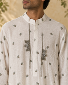Abeer by House of Somarra — Close-up of the band collar, sprig motifs and embellished front.