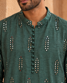 Aks by House of Somarra — Close-up of the band collar, covered buttons and mirror clusters.