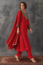 Aarika by House of Somarra — Walking view showing the flowing red kurta and dupatta.