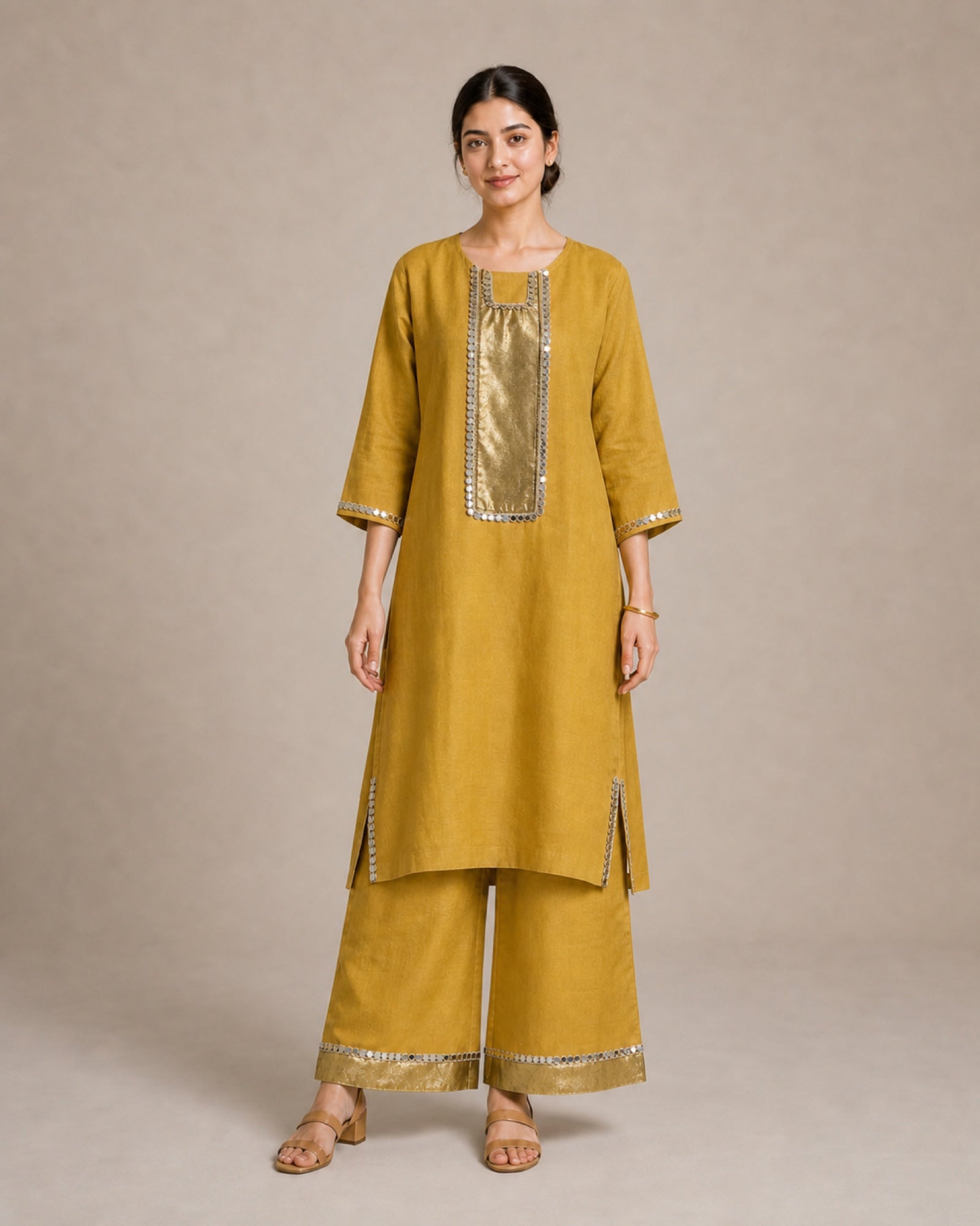 Aabha gold-mustard pure-linen co-ord suit, full front view with antique-shimmer yoke and mirror-lace trim.