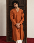 Aatish: Burnt Orange Angrakha Men's Kurta Set — portrait view of the kurta set.