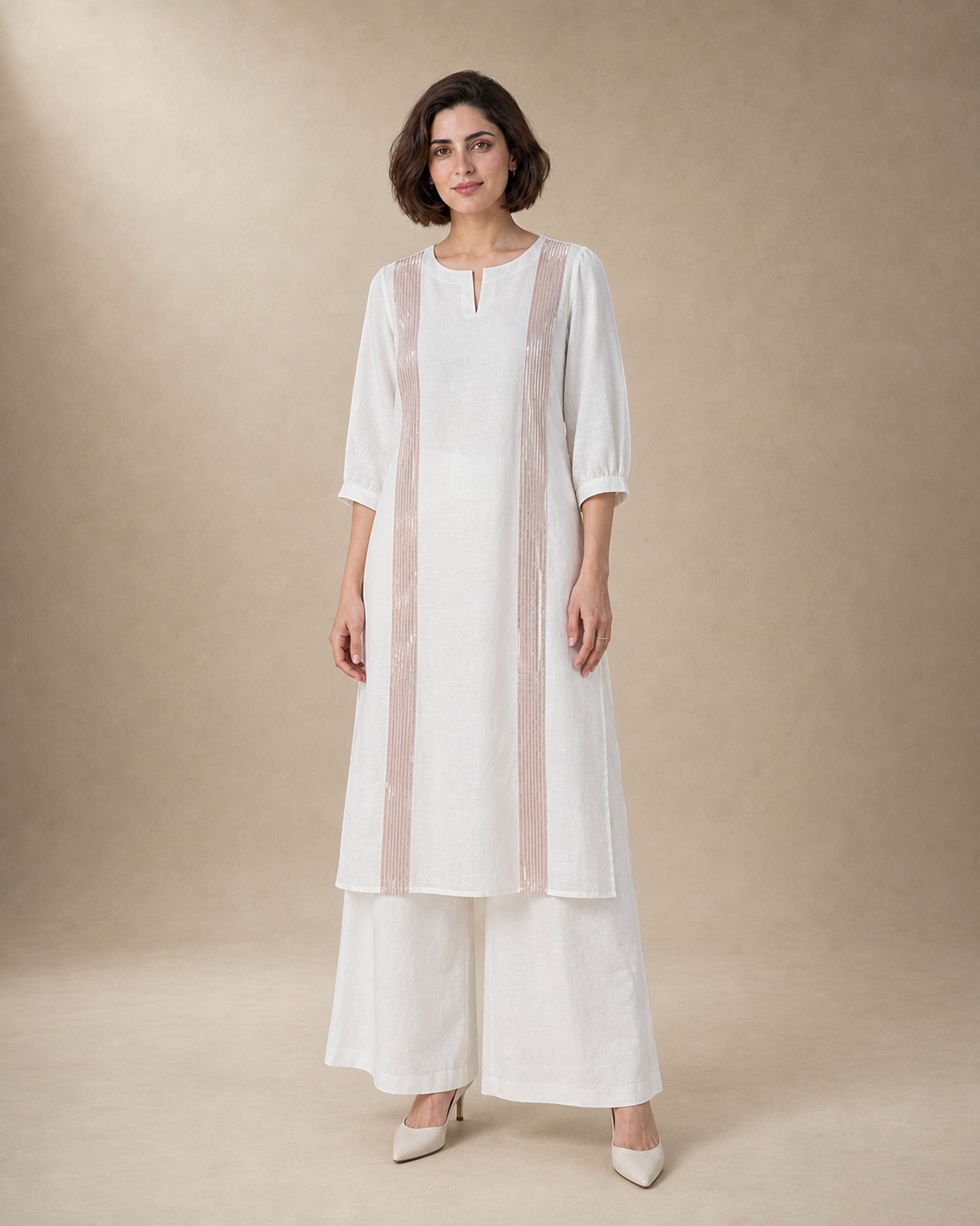 Aurelle white linen co-ord set with rose-gold-colour structured front trim and matching broad linen palazzos, front view