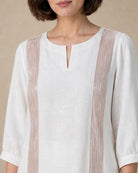 Close-up of the rose-gold-colour wire/structured trim on the front of the Aurelle white linen co-ord top