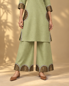 Arpita by House of Somarra — Close-up of the semicircle mirror-lace trouser hem and side detail.