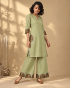 Arpita by House of Somarra — Full-length view showing the kurta and decorated flared trousers.