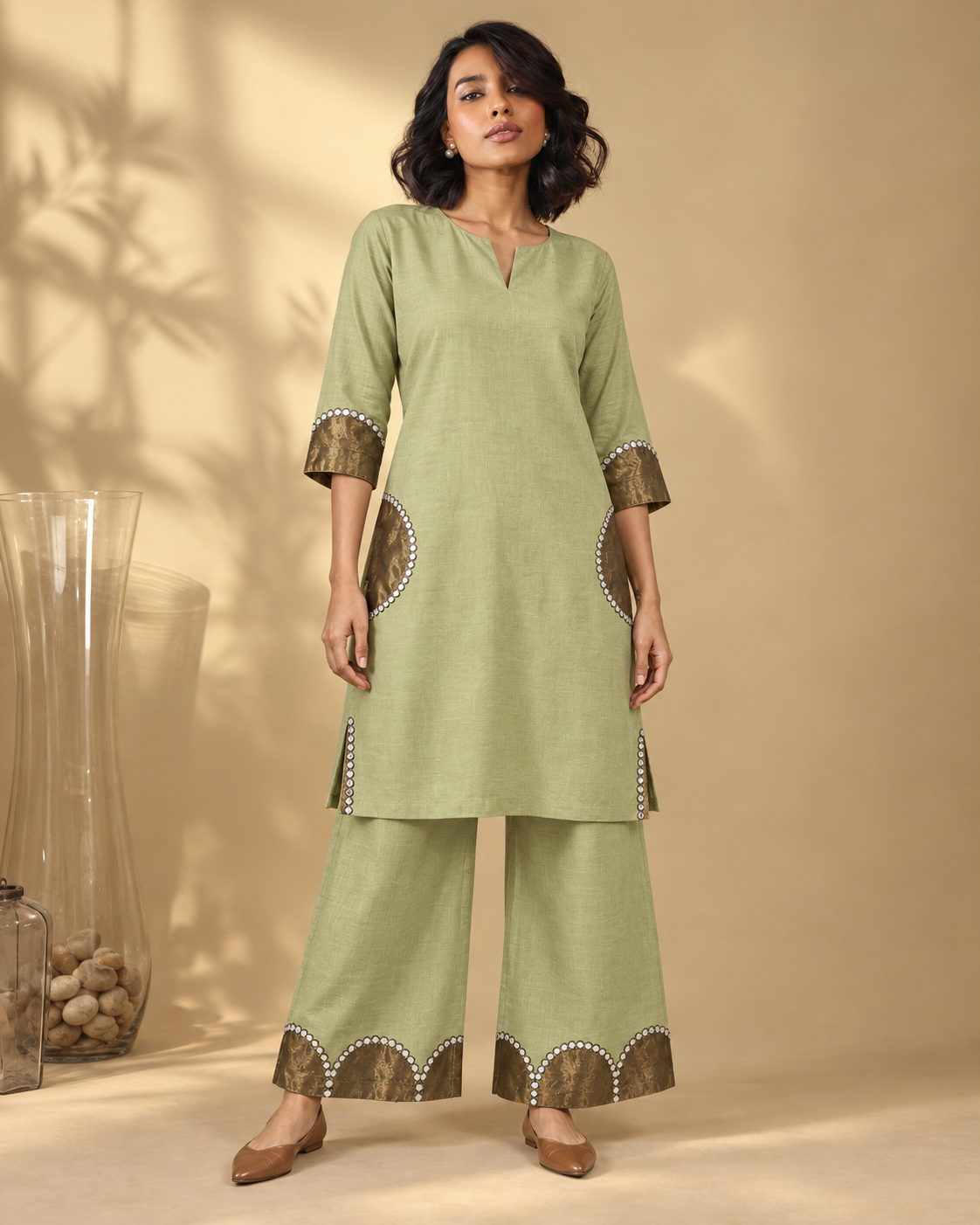 Arpita by House of Somarra — Front view of the pale green-gold kurta and wide trousers.