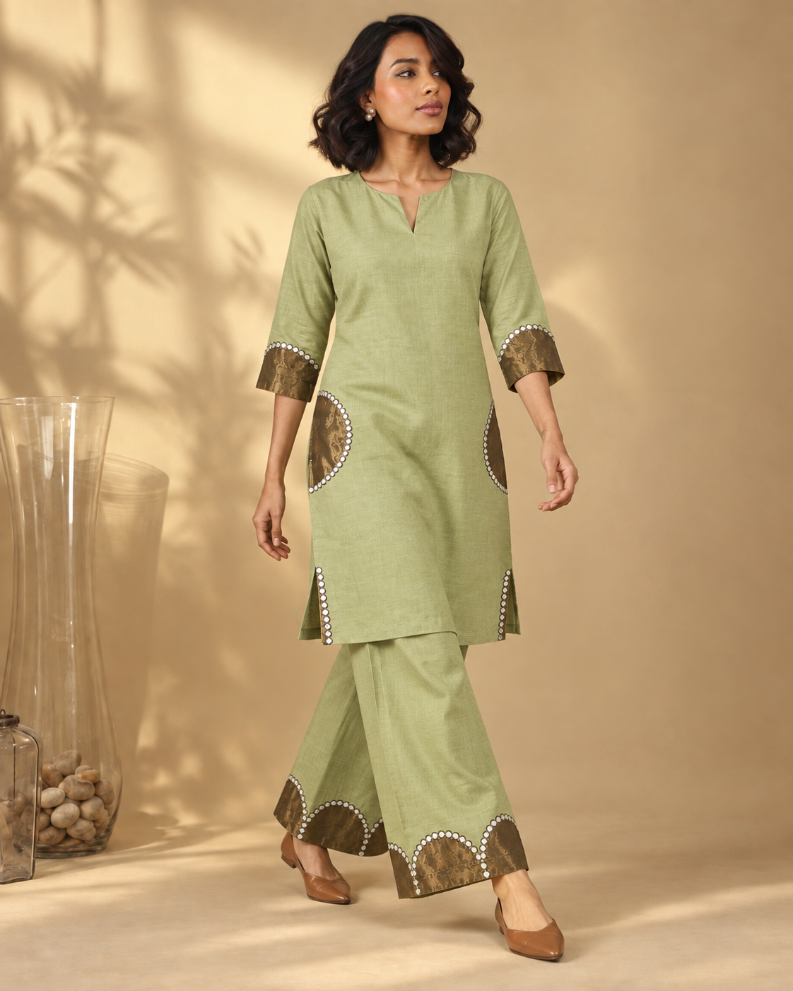 Arpita by House of Somarra — Walking view showing the flared trousers and semicircle trim.
