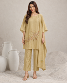 Taru by House of Somarra — Full-length front view of the beige suit and dupatta.