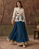 Samaira by House of Somarra — Walking view showing the blue skirt and gold-toned border.
