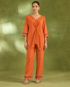 Arunika by House of Somarra — Full-length view showing the gathered front and decorated cuffs.