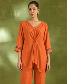Arunika by House of Somarra — Close-up of the gathered orange neckline and sleeve borders.