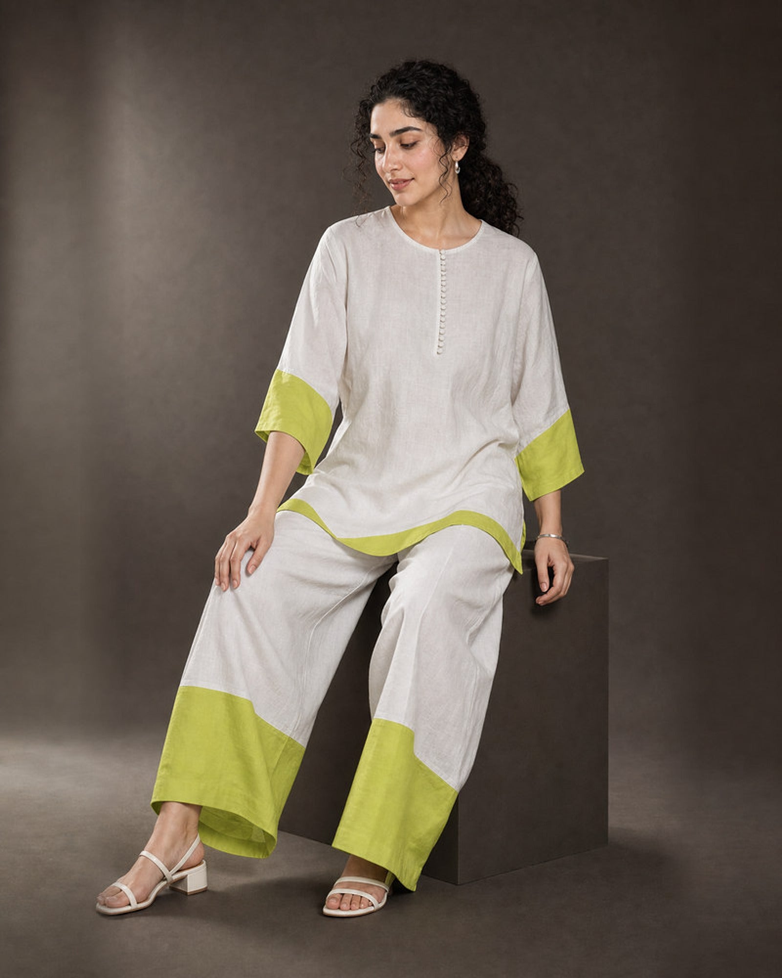 Elara: White & Neon Lime Linen Co-ord Set – seated three-quarter