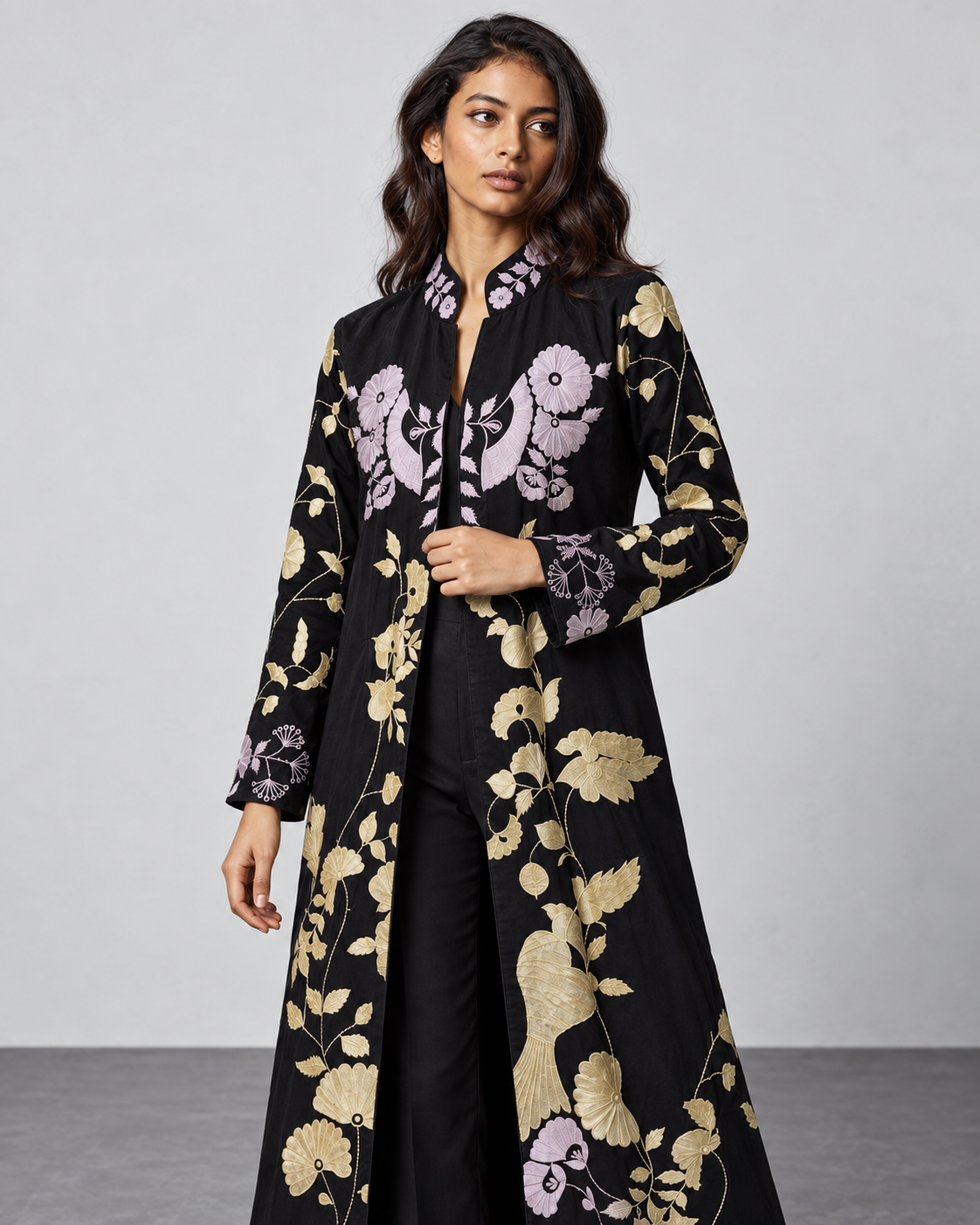 Hanami by House of Somarra — Front portrait of the black kurta's pink and gold-toned botanical motifs.