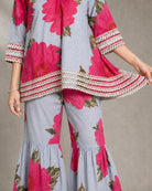 Gulaira bold pink floral lace garara co-ord set – lace-border construction close-up