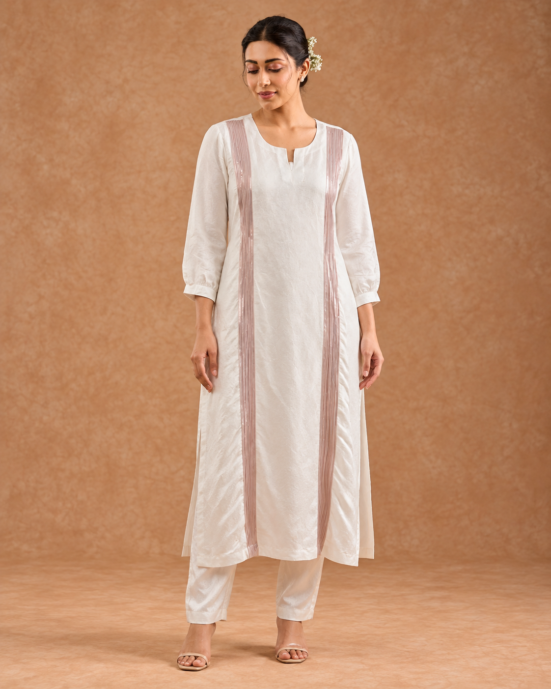 Aurelle by House of Somarra — Three-quarter view of the white ensemble and decorative bands.