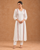 Aurelle by House of Somarra — Full-length view showing the white tunic's long vertical accents.